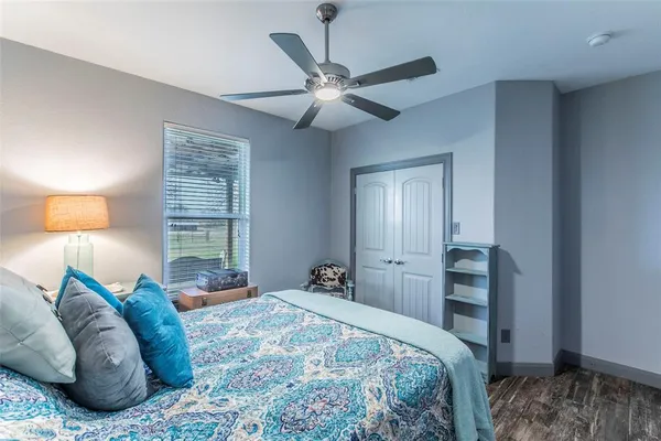 a bedroom with a bed and window