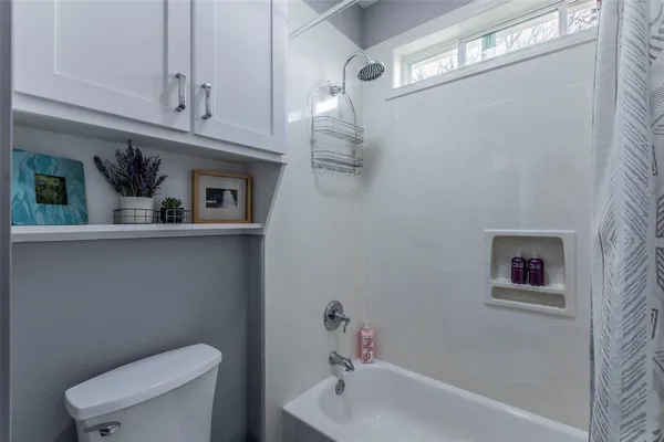 a bathroom with a sink a toilet and bathtub