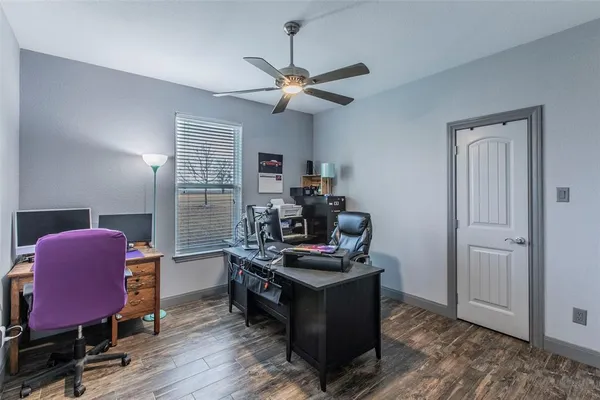 a workspace with furniture and wooden floor