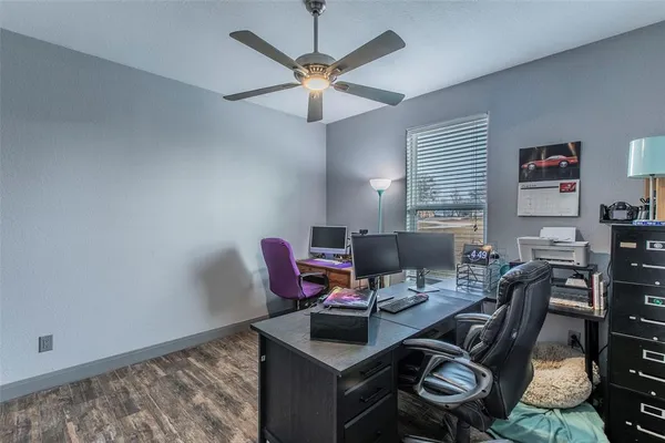 a workspace with furniture and a window