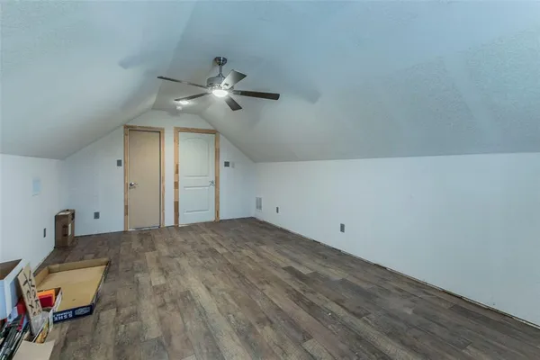 a view of empty room with ceiling fan