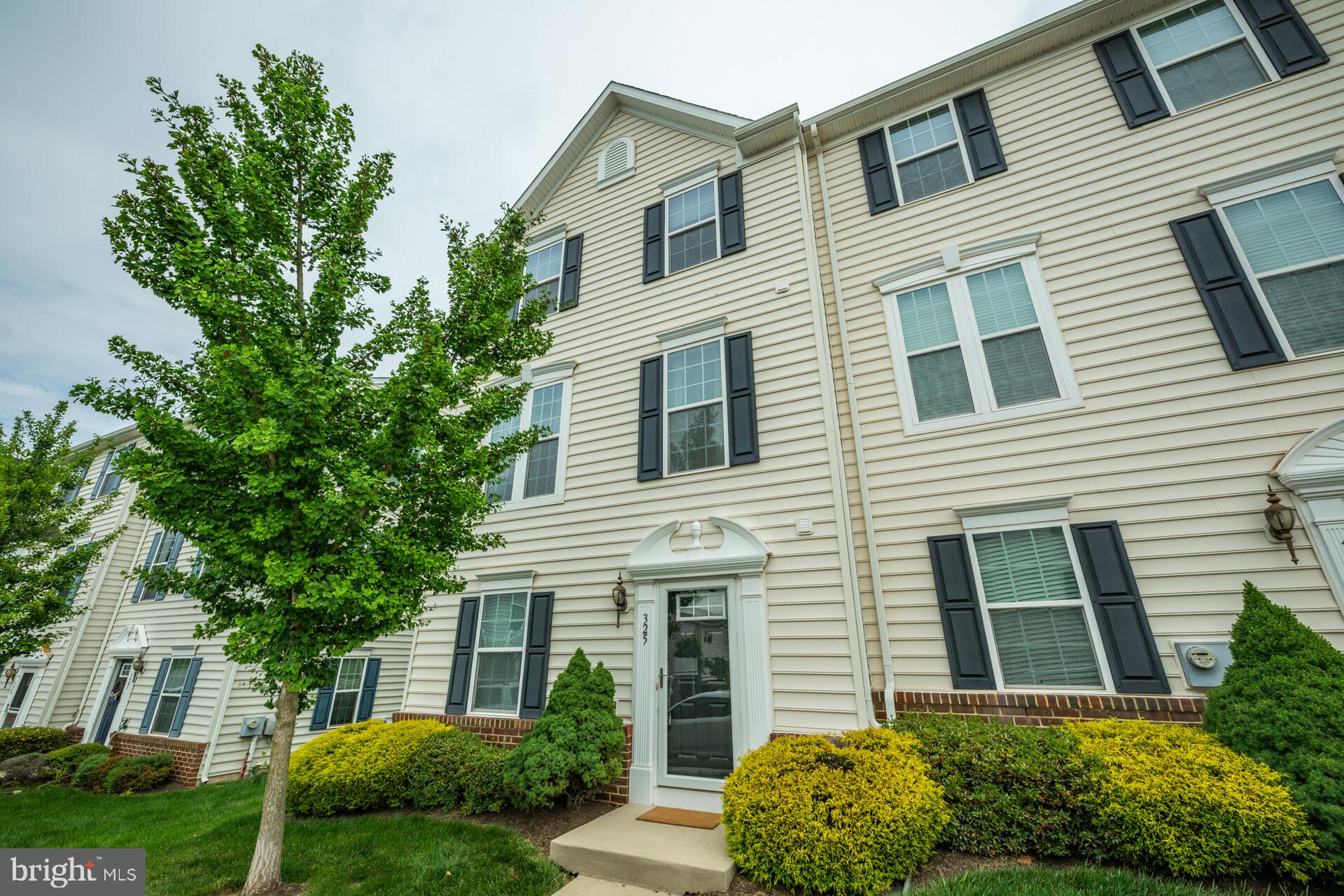 325 Schmidt Road Phoenixville, PA 19460 - Photo 2 of 27 a view of a house with brick walls and flower plants