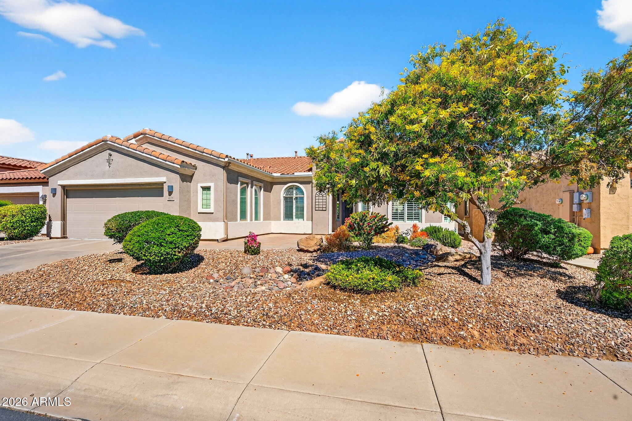 4128 East Jude Lane Gilbert, AZ 85298 - Photo 1 of 58 a front view of a house with garden