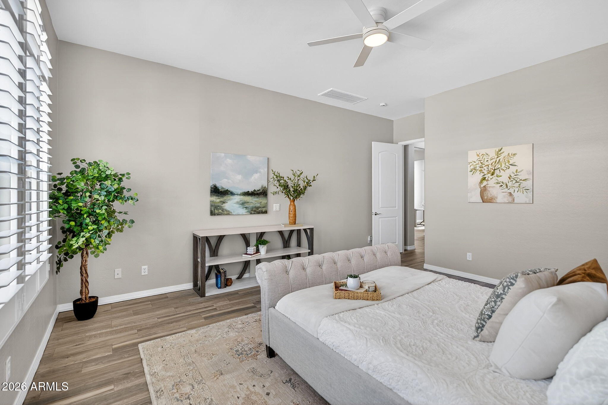 4128 East Jude Lane Gilbert, AZ 85298 - Photo 24 of 58 a bedroom with a bed and a potted plant