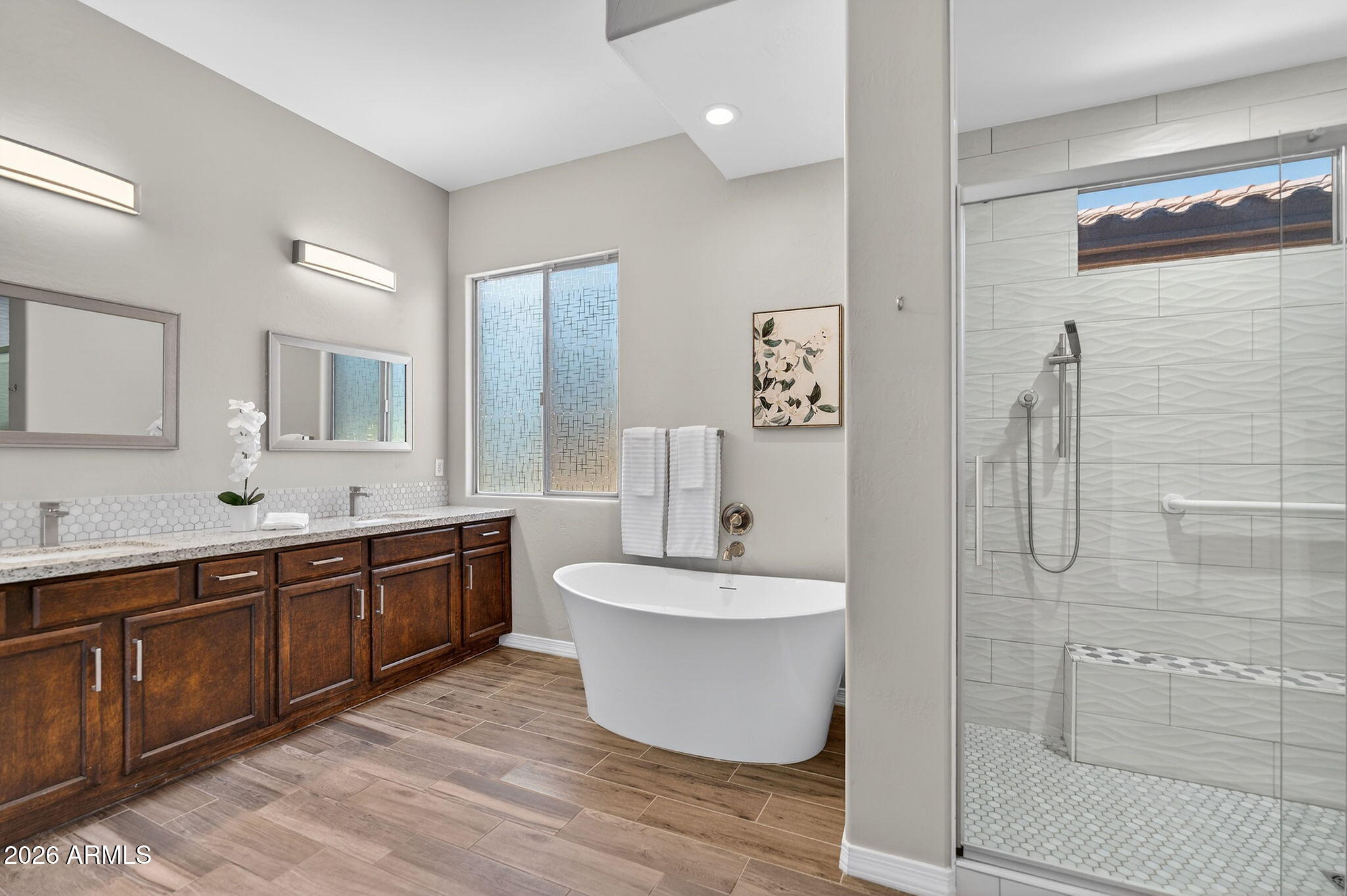 4128 East Jude Lane Gilbert, AZ 85298 - Photo 27 of 58 a spacious bathroom with a bathtub sink mirror and toilet