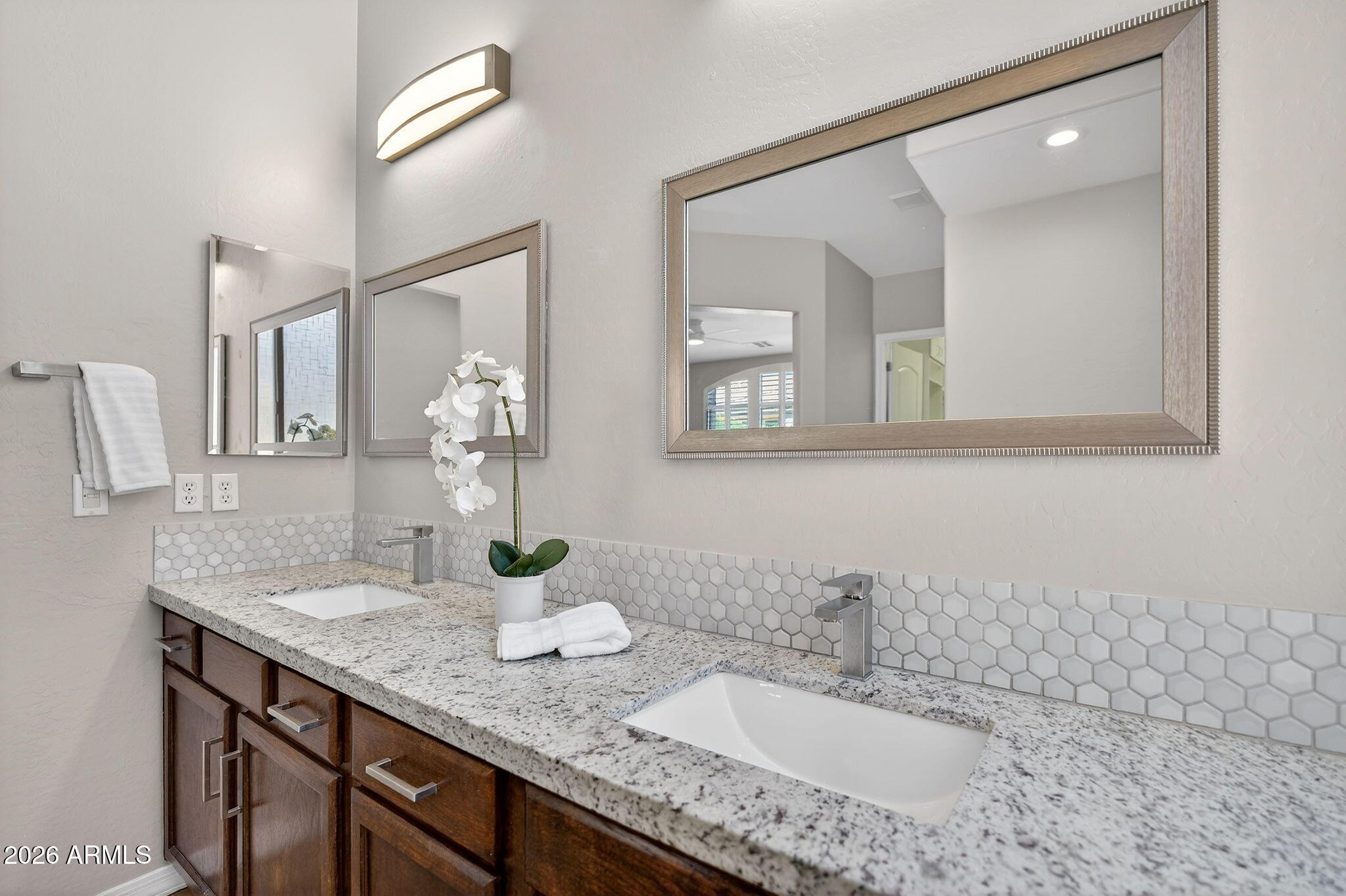 4128 East Jude Lane Gilbert, AZ 85298 - Photo 29 of 58 a bathroom with a granite countertop sink and a mirror