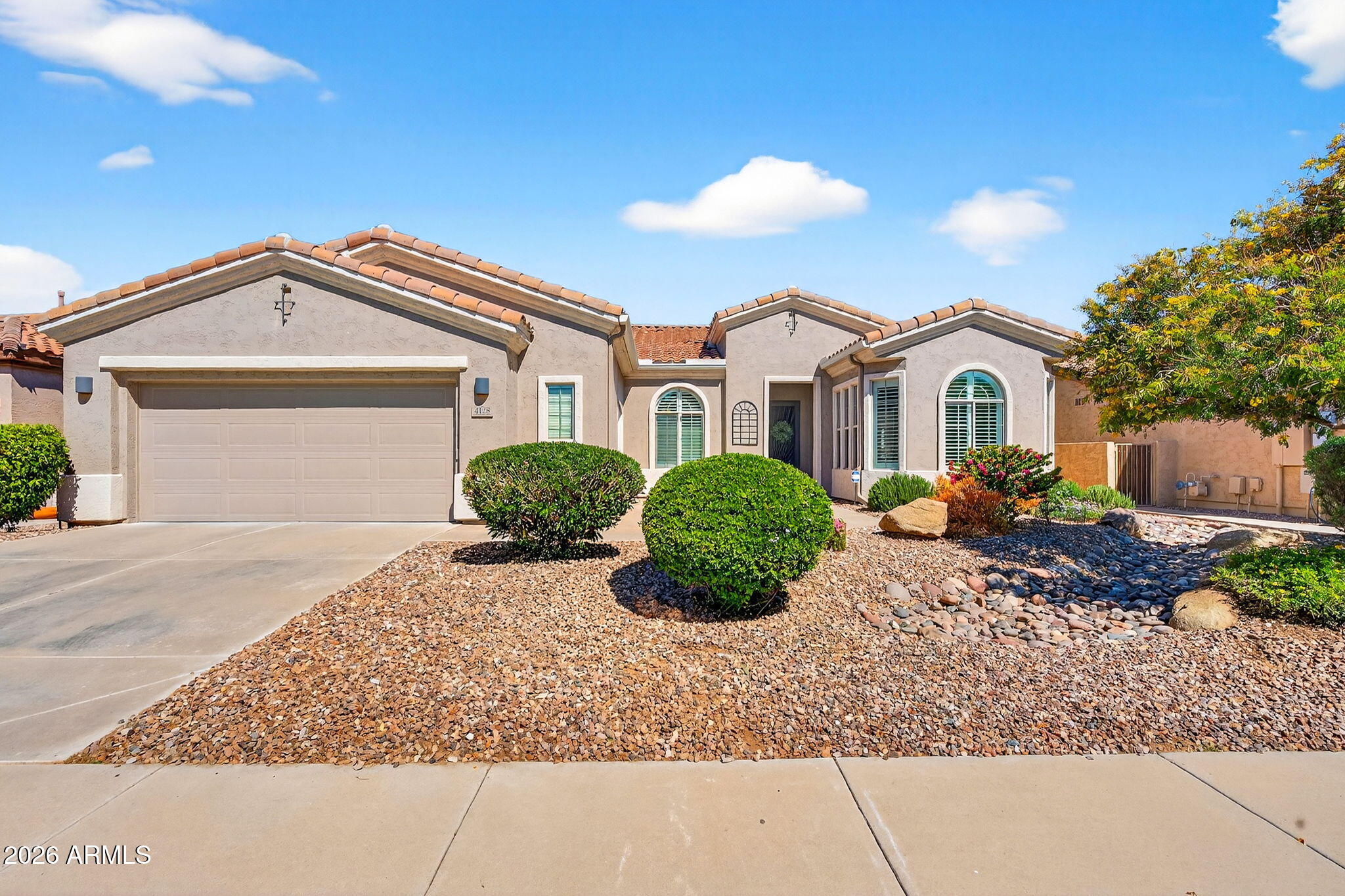 4128 East Jude Lane Gilbert, AZ 85298 - Photo 2 of 58 a front view of a house with garden