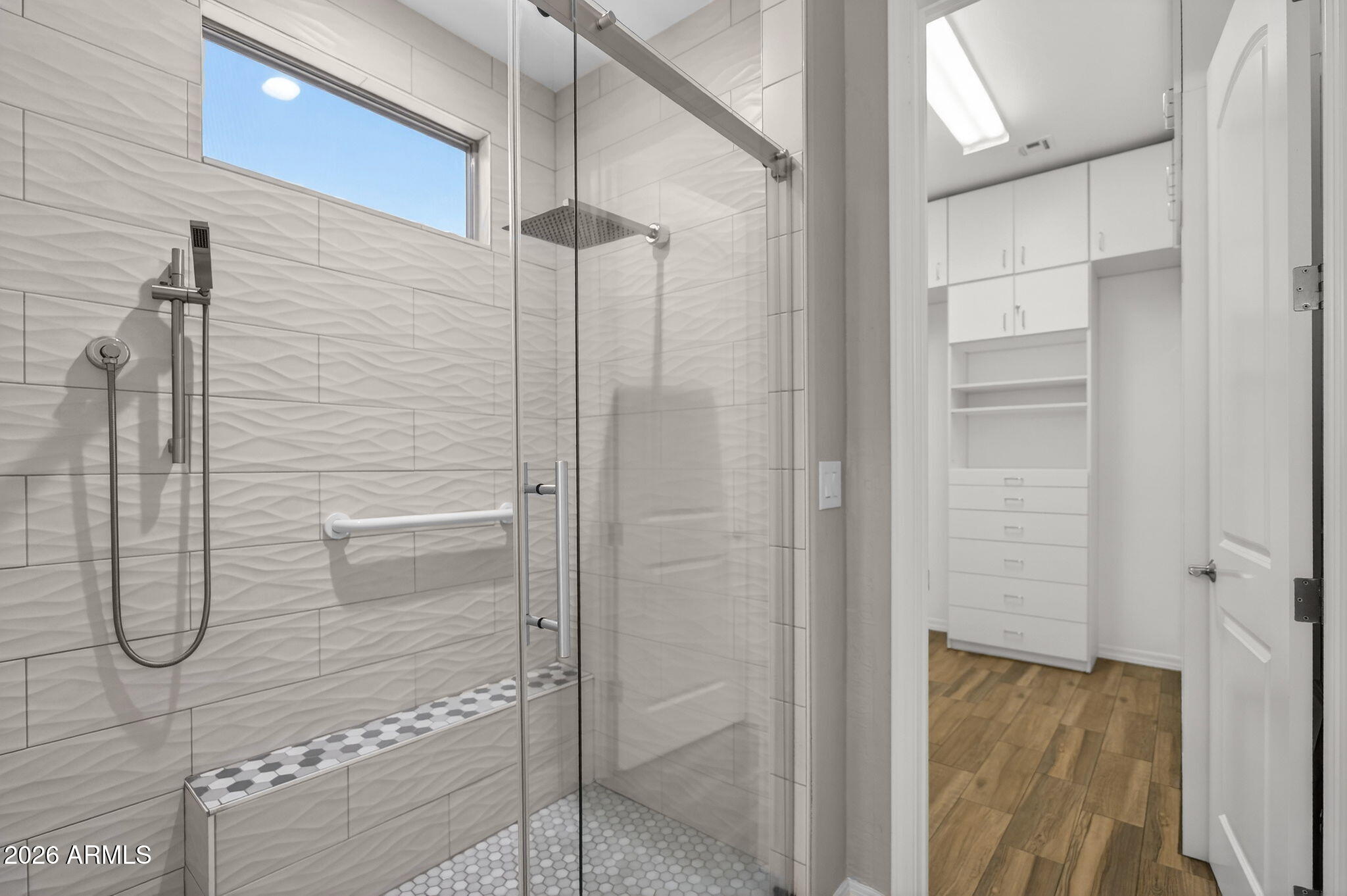 4128 East Jude Lane Gilbert, AZ 85298 - Photo 31 of 58 a bathroom with a glass shower door