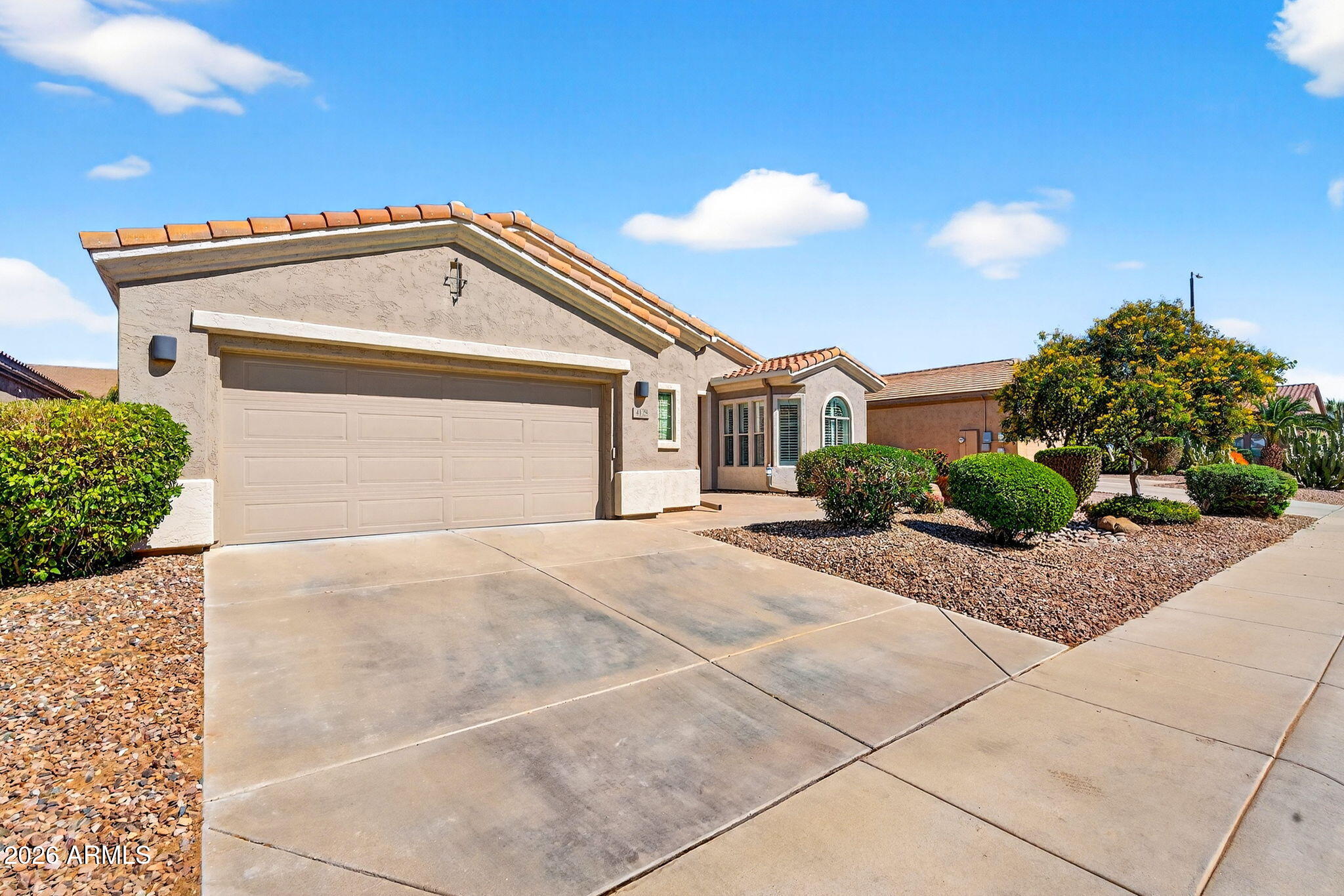4128 East Jude Lane Gilbert, AZ 85298 - Photo 44 of 58 a view of a house with a outdoor space and windows