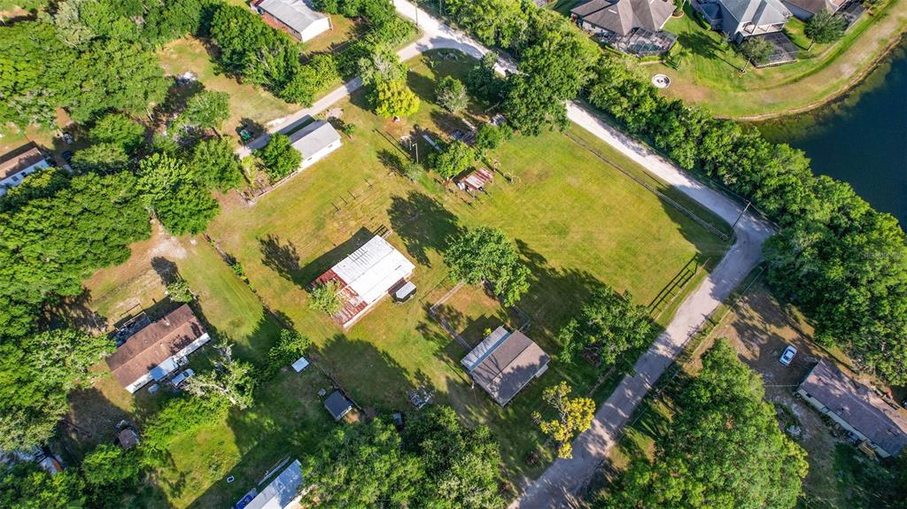 1747 Anna Road Odessa, FL 33556 - Photo 12 of 19 an aerial view of a house with a yard and swimming pool