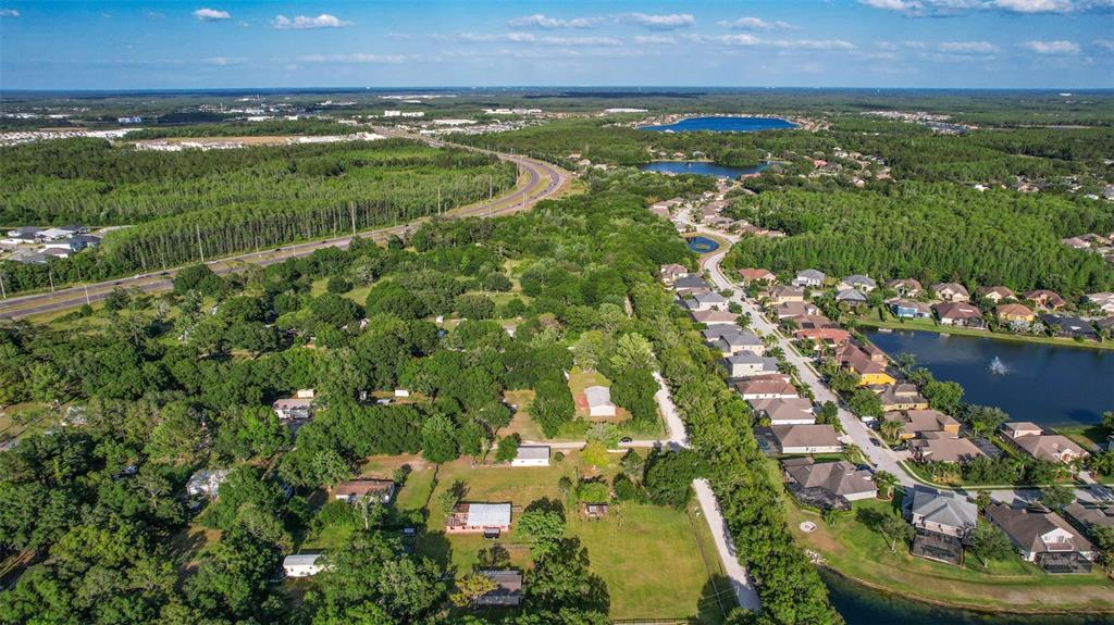 1747 Anna Road Odessa, FL 33556 - Photo 15 of 19 an aerial view of residential houses with outdoor space and trees
