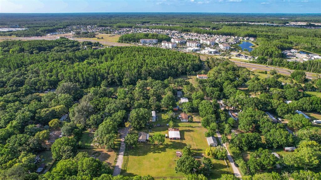 1747 Anna Road Odessa, FL 33556 - Photo 16 of 19 an aerial view of residential houses with outdoor space and trees