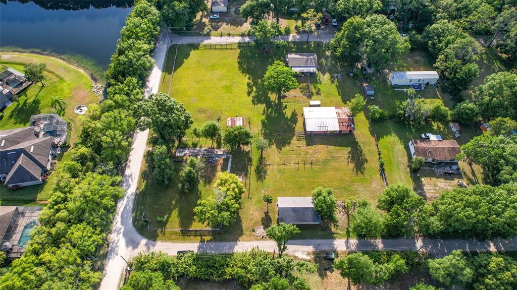 1747 Anna Road Odessa, FL 33556 - Photo 10 of 19 an aerial view of residential house with swimming pool and outdoor space
