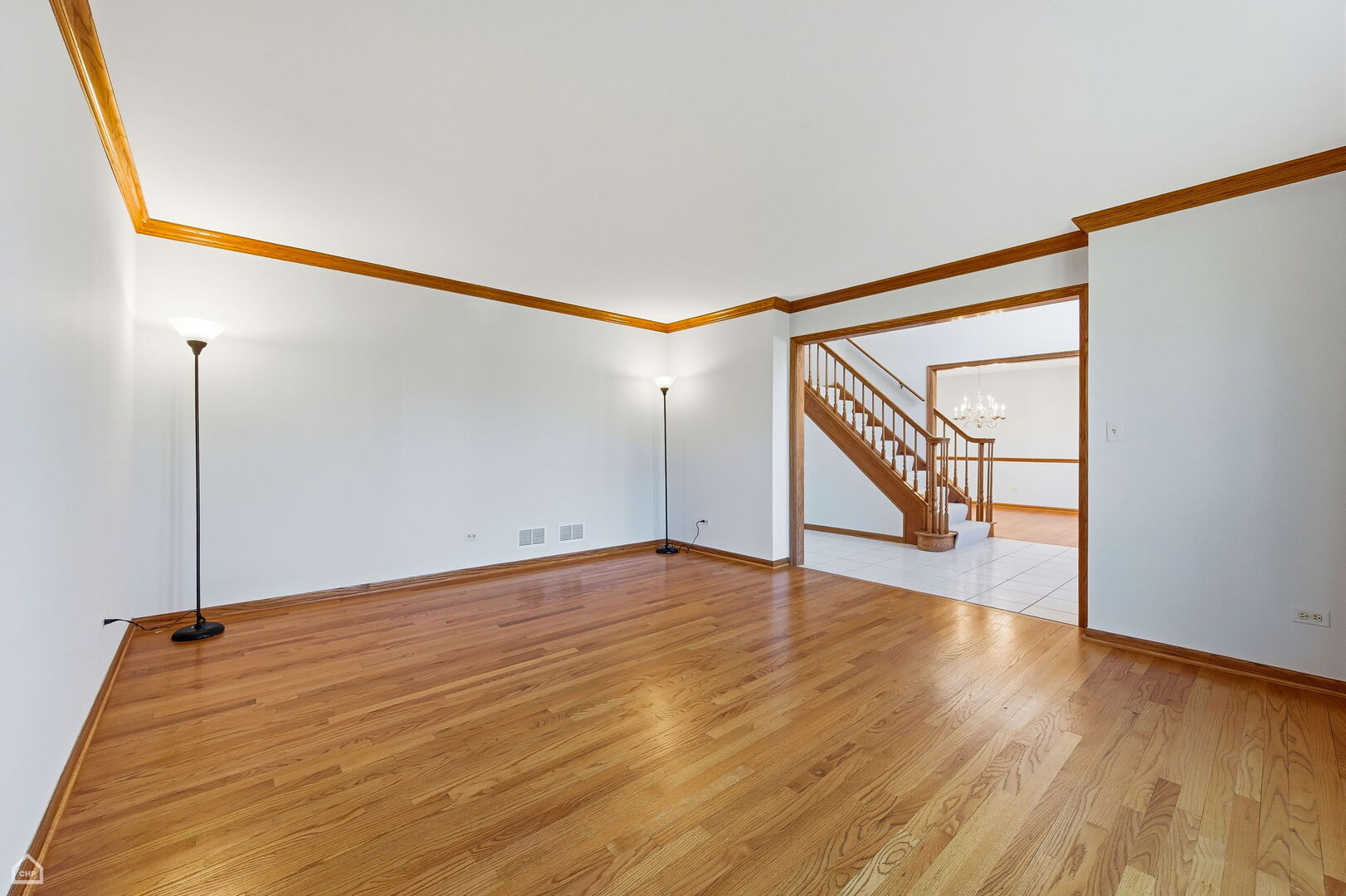13725 Kit Lane Lemont, IL 60439 - Photo 18 of 61 a view of an empty room with wooden floor and a window