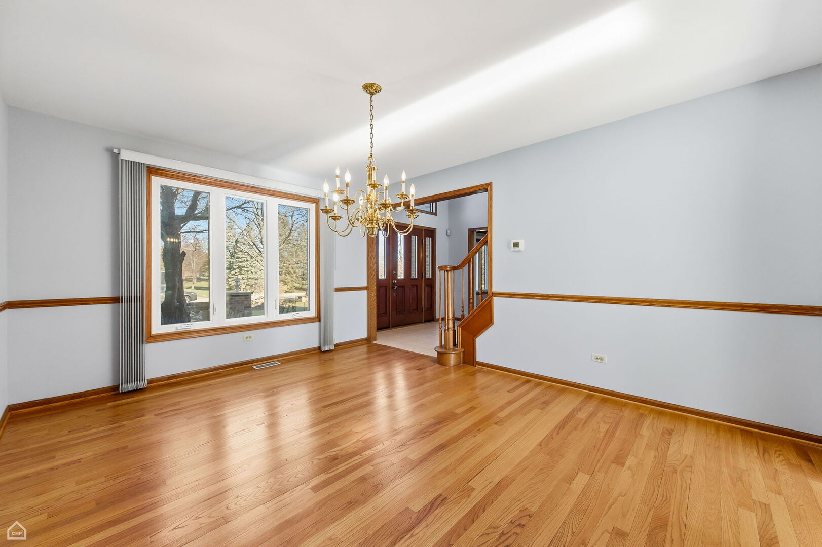 13725 Kit Lane Lemont, IL 60439 - Photo 19 of 61 a view of empty room with wooden floor and fan