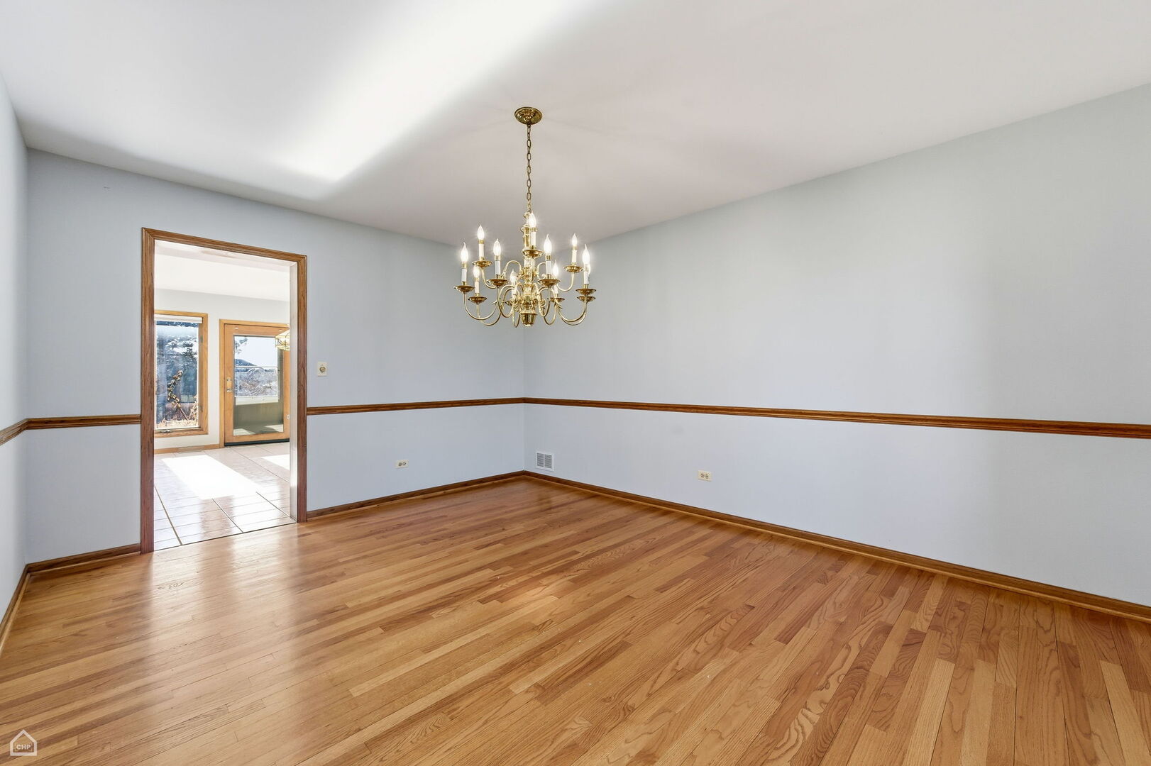 13725 Kit Lane Lemont, IL 60439 - Photo 20 of 61 a view of an empty room with wooden floor and a window