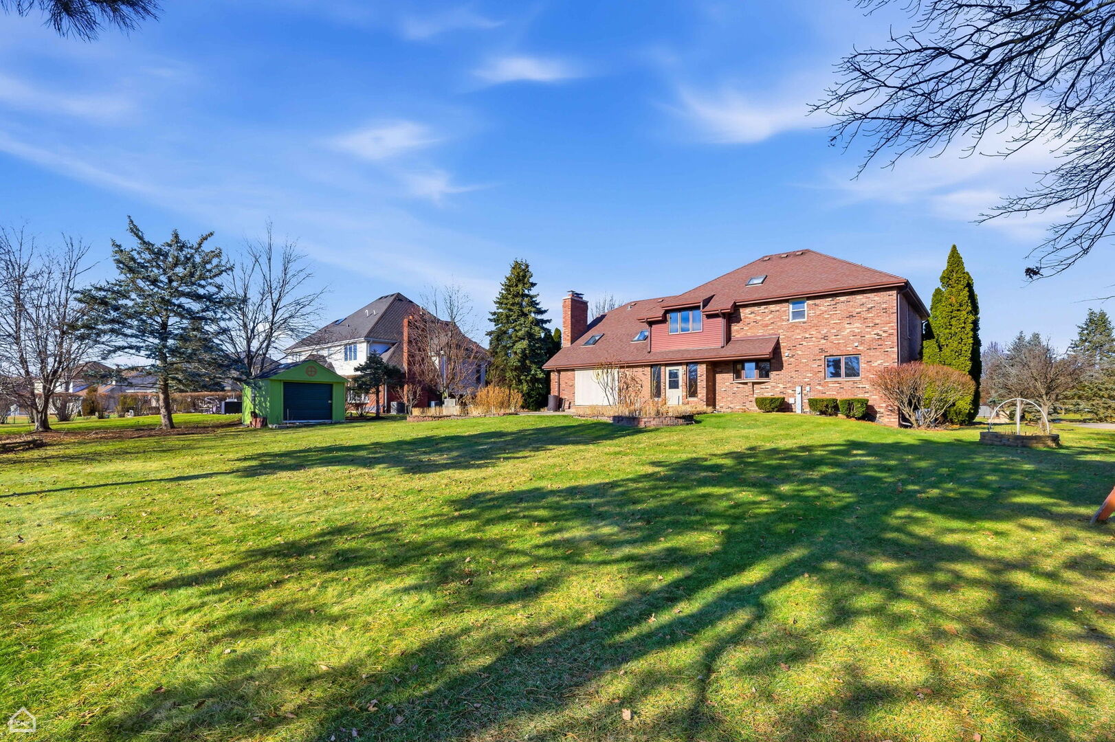13725 Kit Lane Lemont, IL 60439 - Photo 24 of 61 a view of a big house with a big yard and large trees