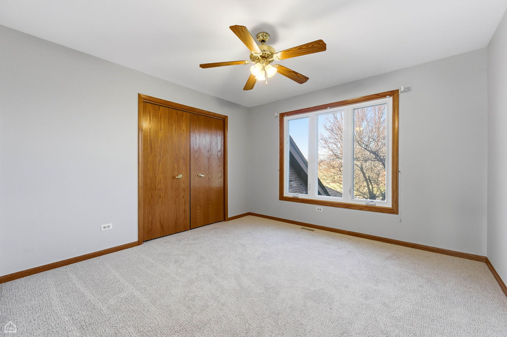 13725 Kit Lane Lemont, IL 60439 - Photo 43 of 61 a view of an empty room with window a ceiling fan and wooden floor