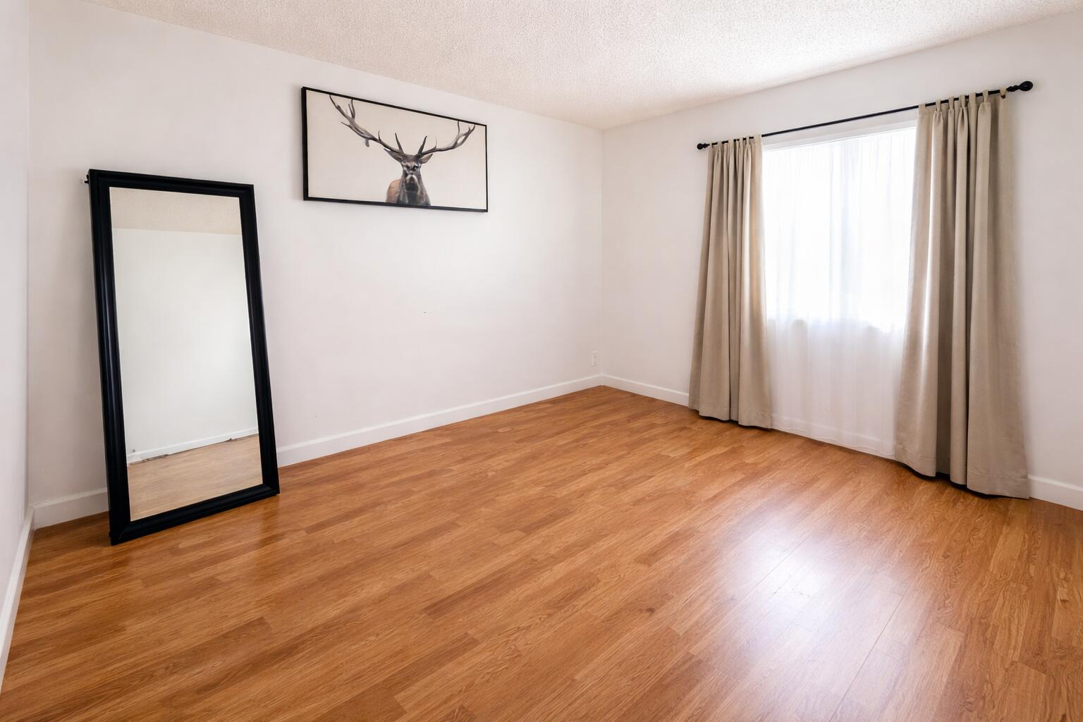 2001 Woolbright Road, Unit F204 Boynton Beach, FL 33426 - Photo 5 of 7 wooden floor in an empty room with a window