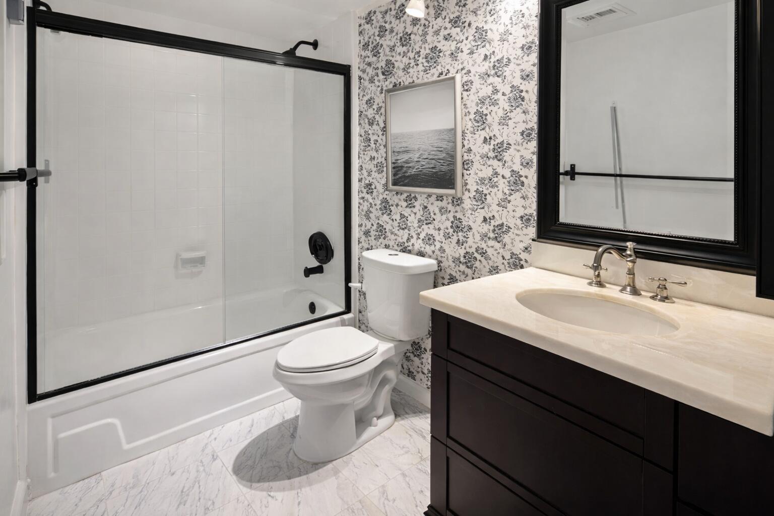 2001 Woolbright Road, Unit F204 Boynton Beach, FL 33426 - Photo 6 of 7 a bathroom with a sink toilet and shower