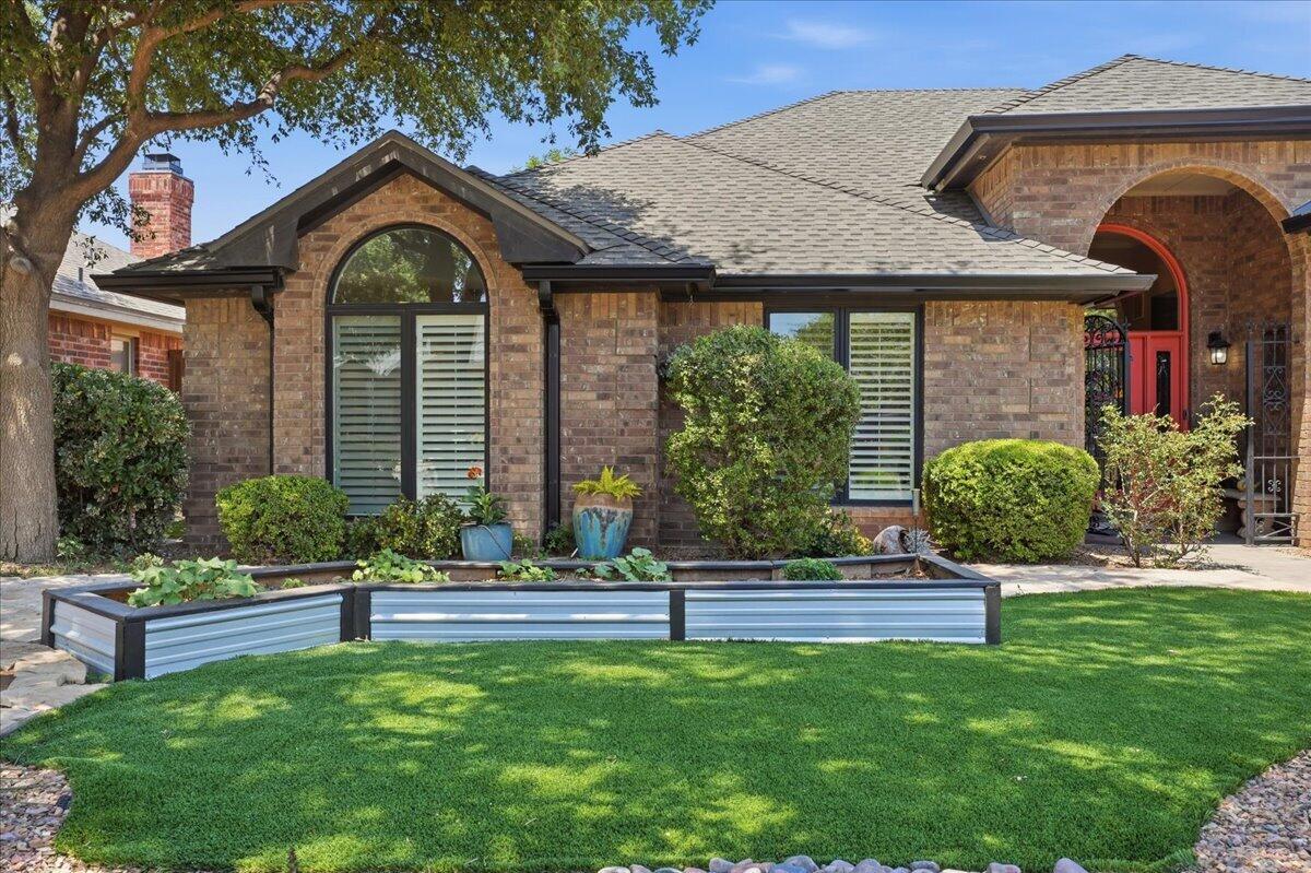 4612 100th Street Lubbock, TX 79424 - Photo 3 of 55 a front view of a house with a yard
