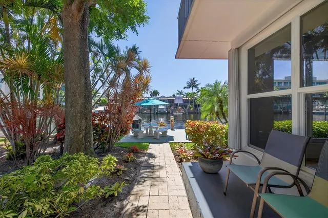 a view of a chairs and table in a patio