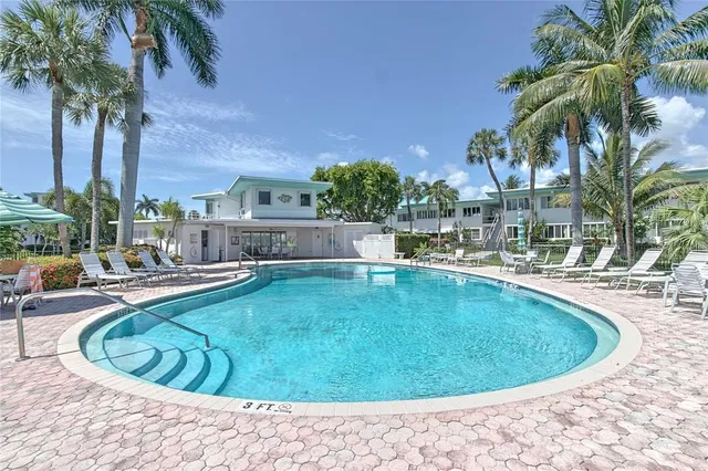 a view of a swimming pool with a patio