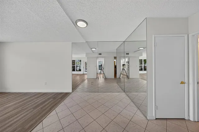 a kitchen with stainless steel appliances a refrigerator sink and cabinets