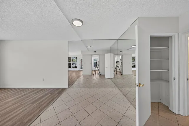 a kitchen with stainless steel appliances granite countertop a stove and a refrigerator