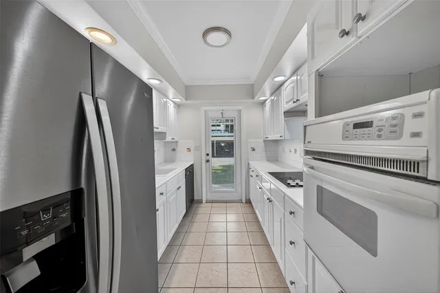 a kitchen with granite countertop a sink and cabinets