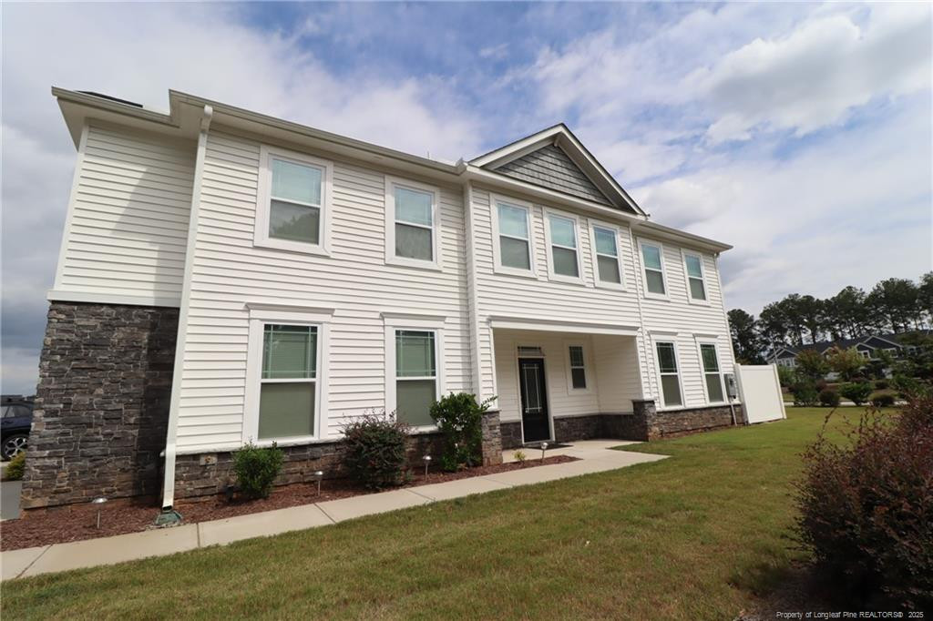 104 Kineton Woods Way Garner, NC 27529 - Photo 2 of 43 a front view of a house with a yard and garage