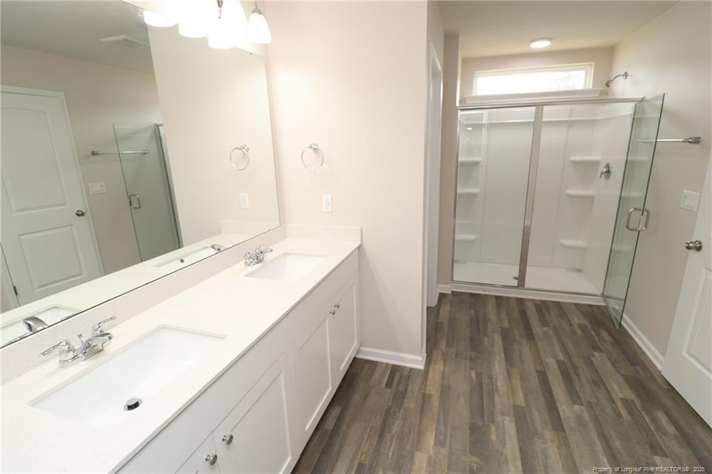 104 Kineton Woods Way Garner, NC 27529 - Photo 31 of 43 a bathroom with a sink and a mirror