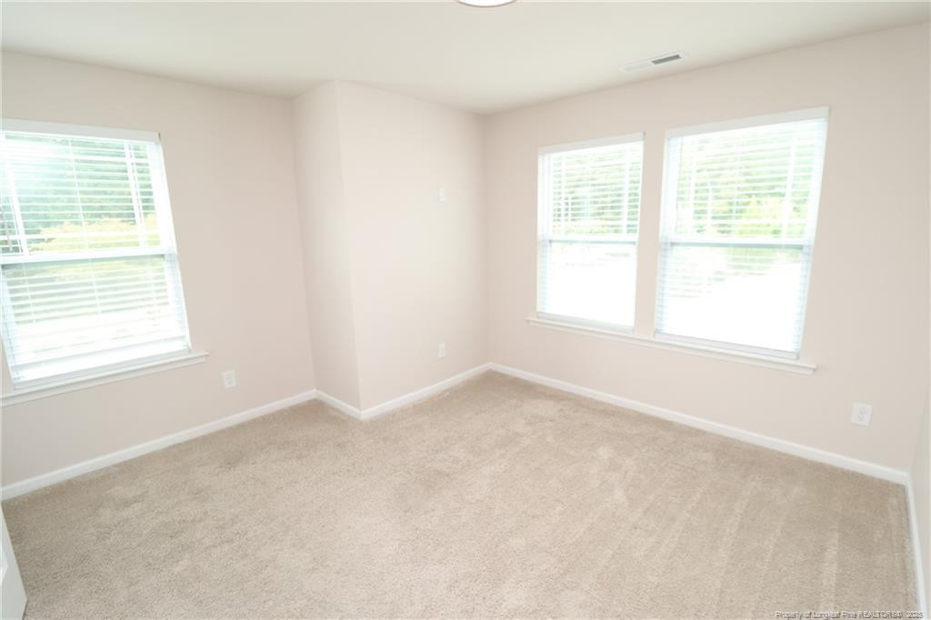 104 Kineton Woods Way Garner, NC 27529 - Photo 34 of 43 an empty room with a window
