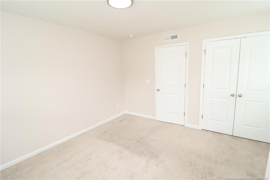 104 Kineton Woods Way Garner, NC 27529 - Photo 36 of 43 a view of an empty room