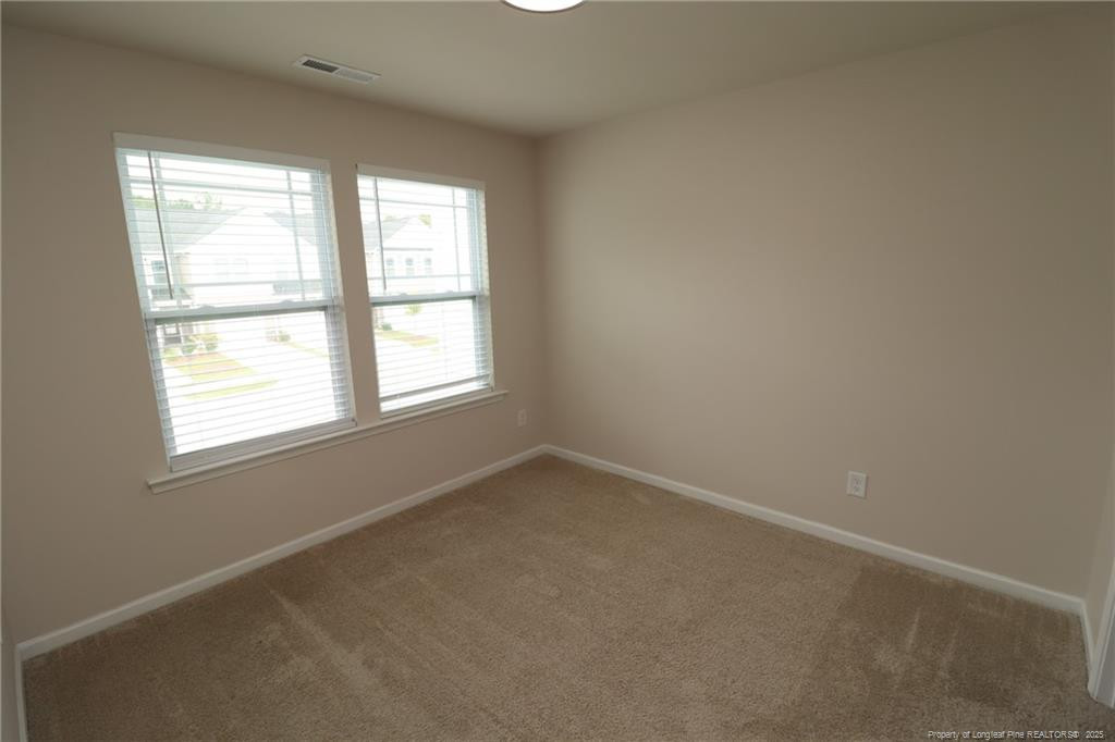 104 Kineton Woods Way Garner, NC 27529 - Photo 37 of 43 an empty room with a window