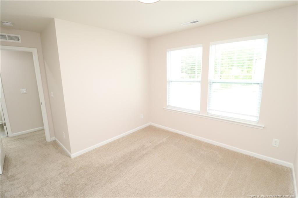 104 Kineton Woods Way Garner, NC 27529 - Photo 38 of 43 an empty room with a window