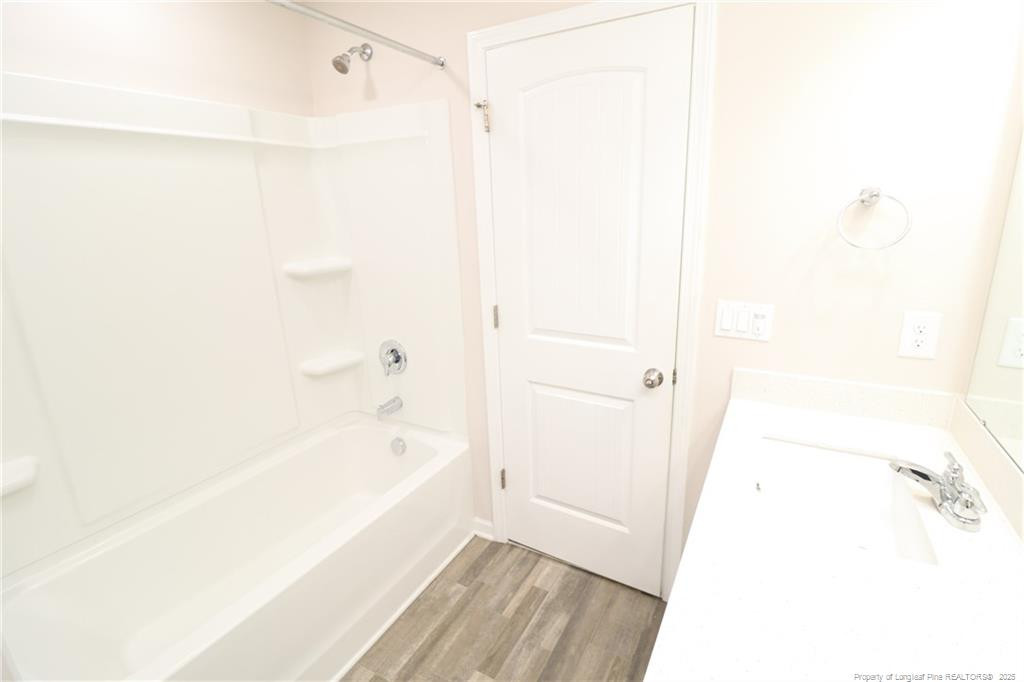 104 Kineton Woods Way Garner, NC 27529 - Photo 42 of 43 a bathroom with a bathtub and a shower