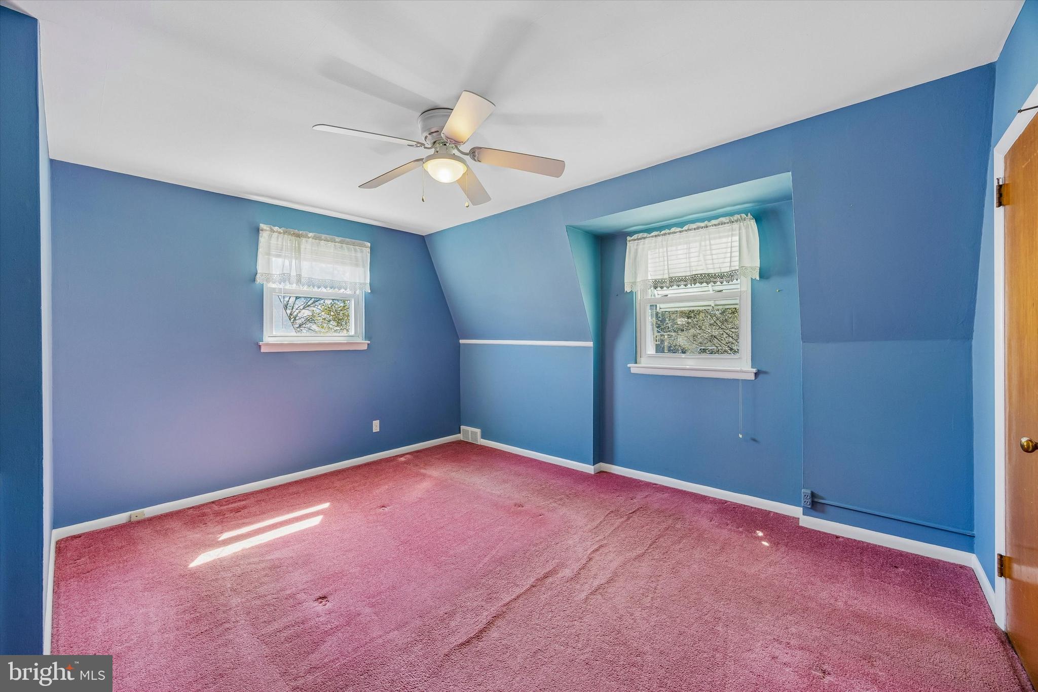 3527 Primrose Road Philadelphia, PA 19114 - Photo 13 of 25 an empty room with windows and fan