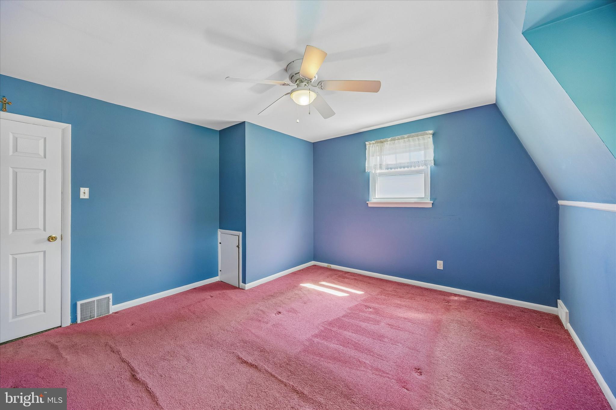 3527 Primrose Road Philadelphia, PA 19114 - Photo 15 of 25 a bedroom with a large bed and a chandelier fan