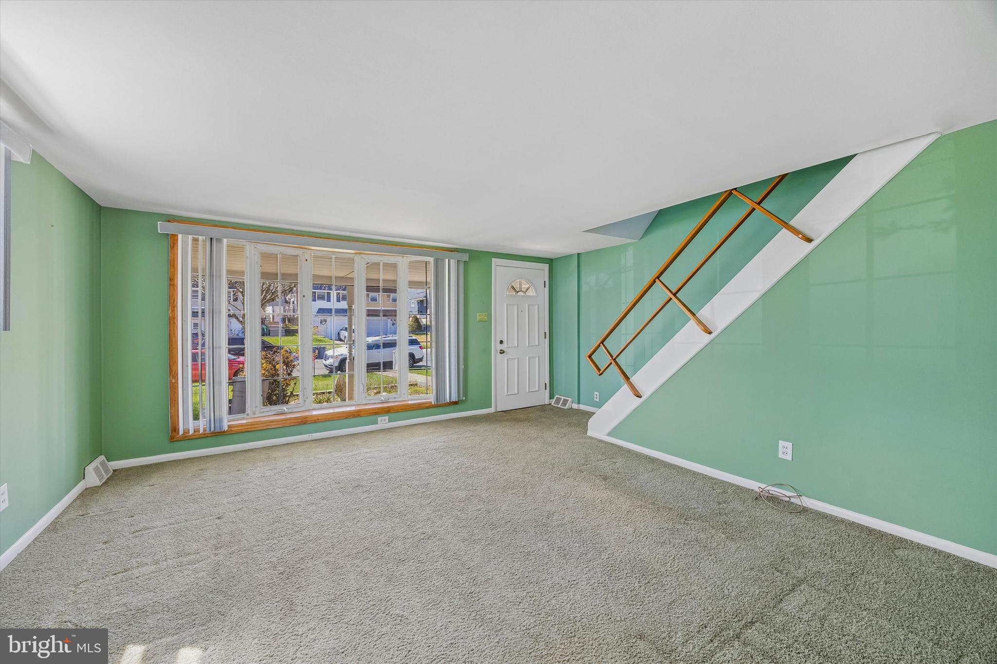 3527 Primrose Road Philadelphia, PA 19114 - Photo 2 of 25 a view of an empty room with a window and a projector