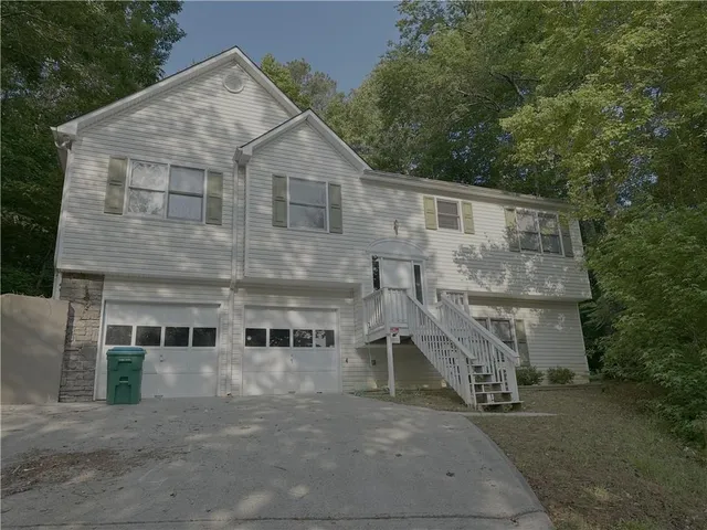 a aerial view of a house with a yard