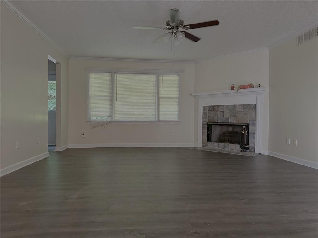 116 Franklin Hills Court Canton, GA 30114 - Photo 2 of 13 a view of an empty room with a fireplace and a window