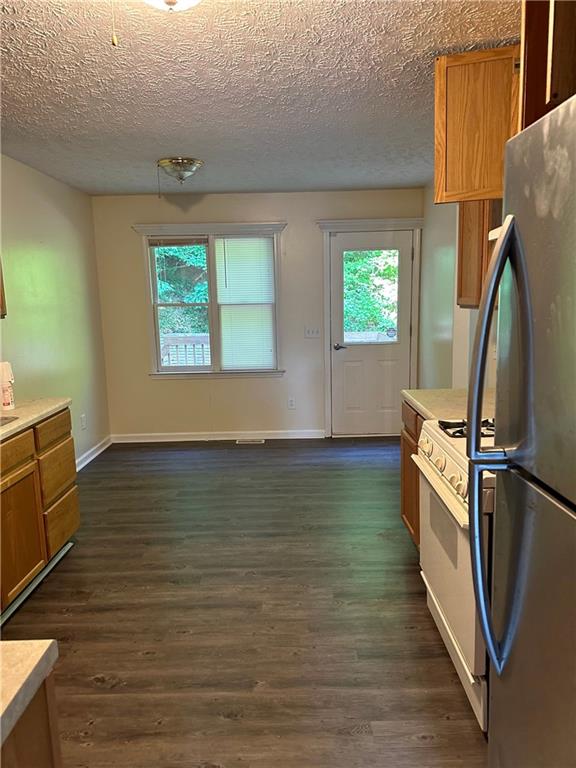 116 Franklin Hills Court Canton, GA 30114 - Photo 4 of 13 a view of a room with wooden floor and fan