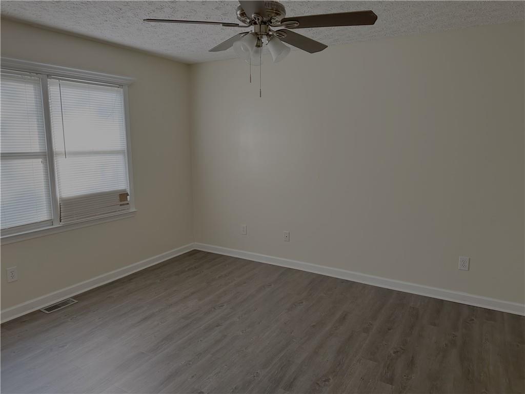 116 Franklin Hills Court Canton, GA 30114 - Photo 8 of 13 an empty room with a window