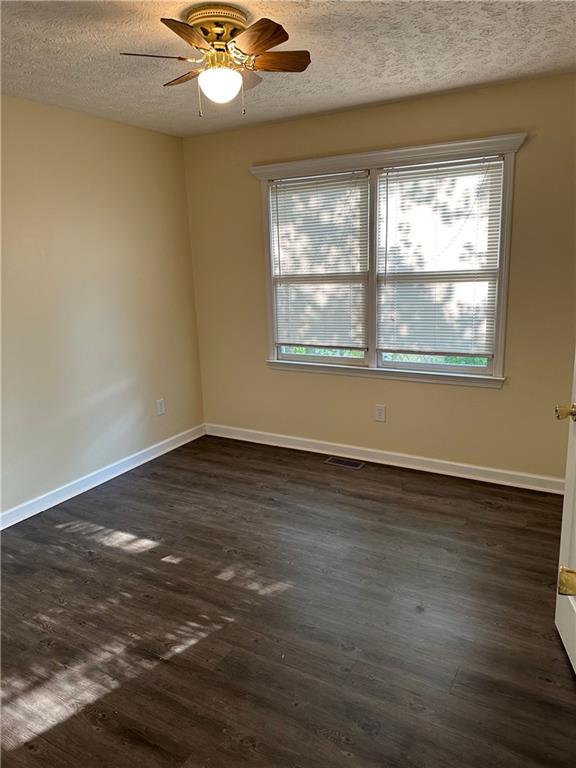 116 Franklin Hills Court Canton, GA 30114 - Photo 9 of 13 an empty room with wooden floor and windows