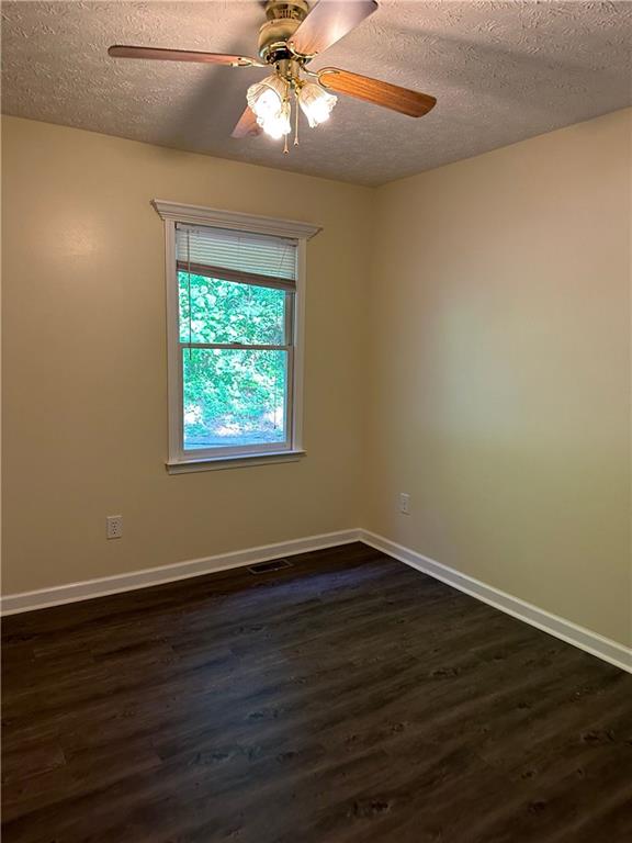 116 Franklin Hills Court Canton, GA 30114 - Photo 10 of 13 a view of an empty room with wooden floor and a window