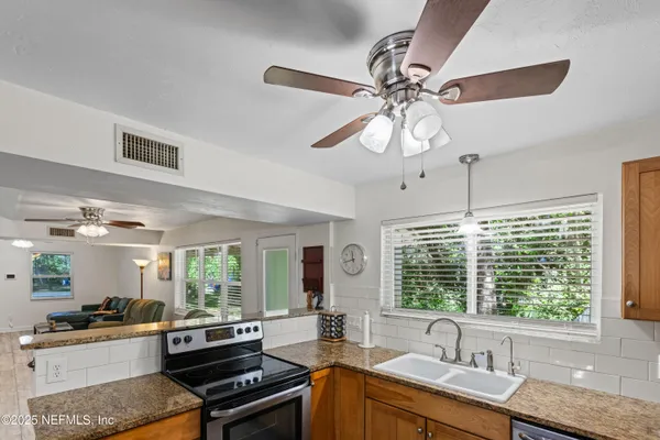 a white refrigerator freezer sitting in a kitchen