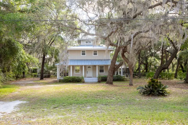 front view of a house with a small yard
