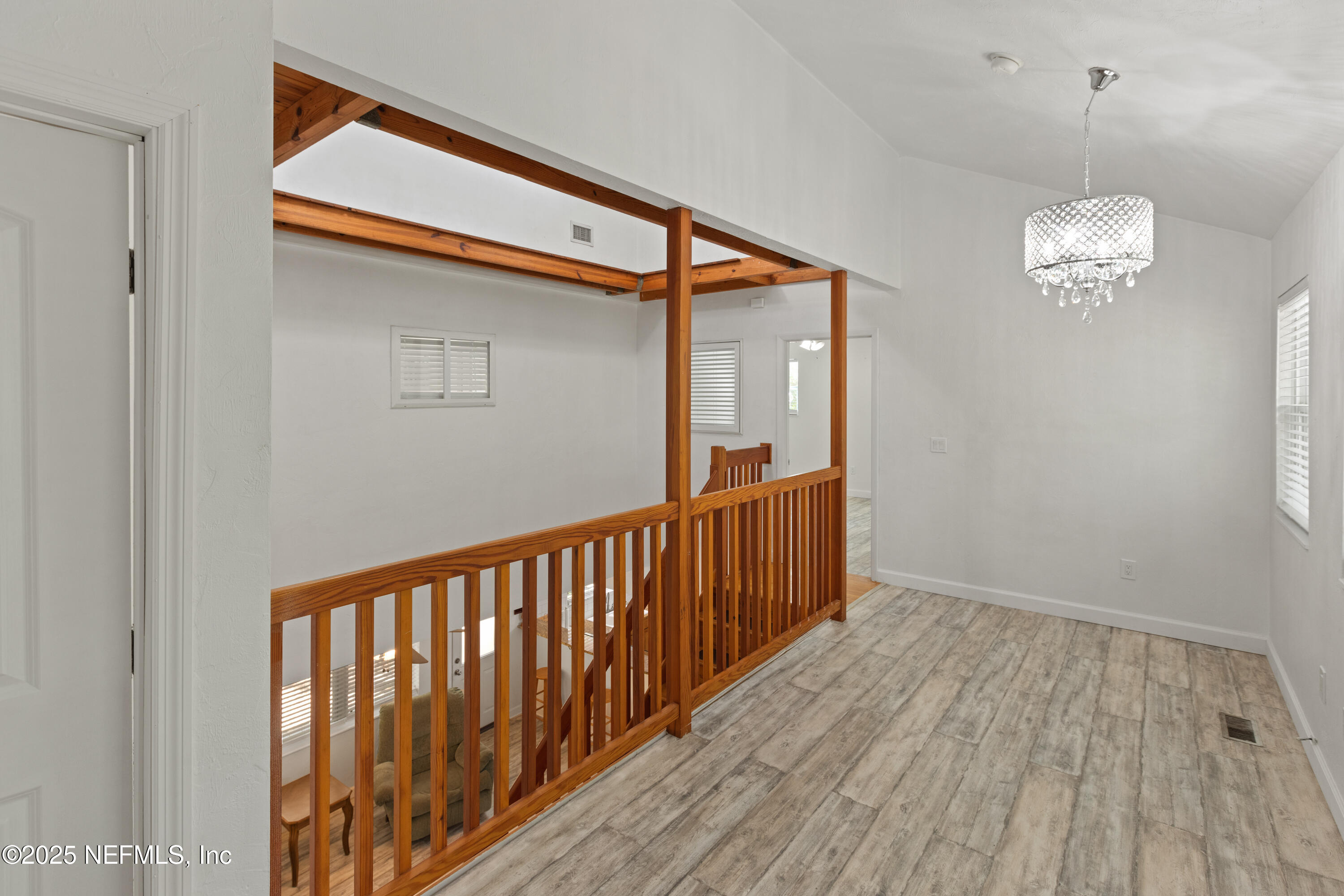 303 Southeast 3rd Avenue Melrose, FL 32666 - Photo 25 of 90 a view of a hallway with wooden floor and staircase