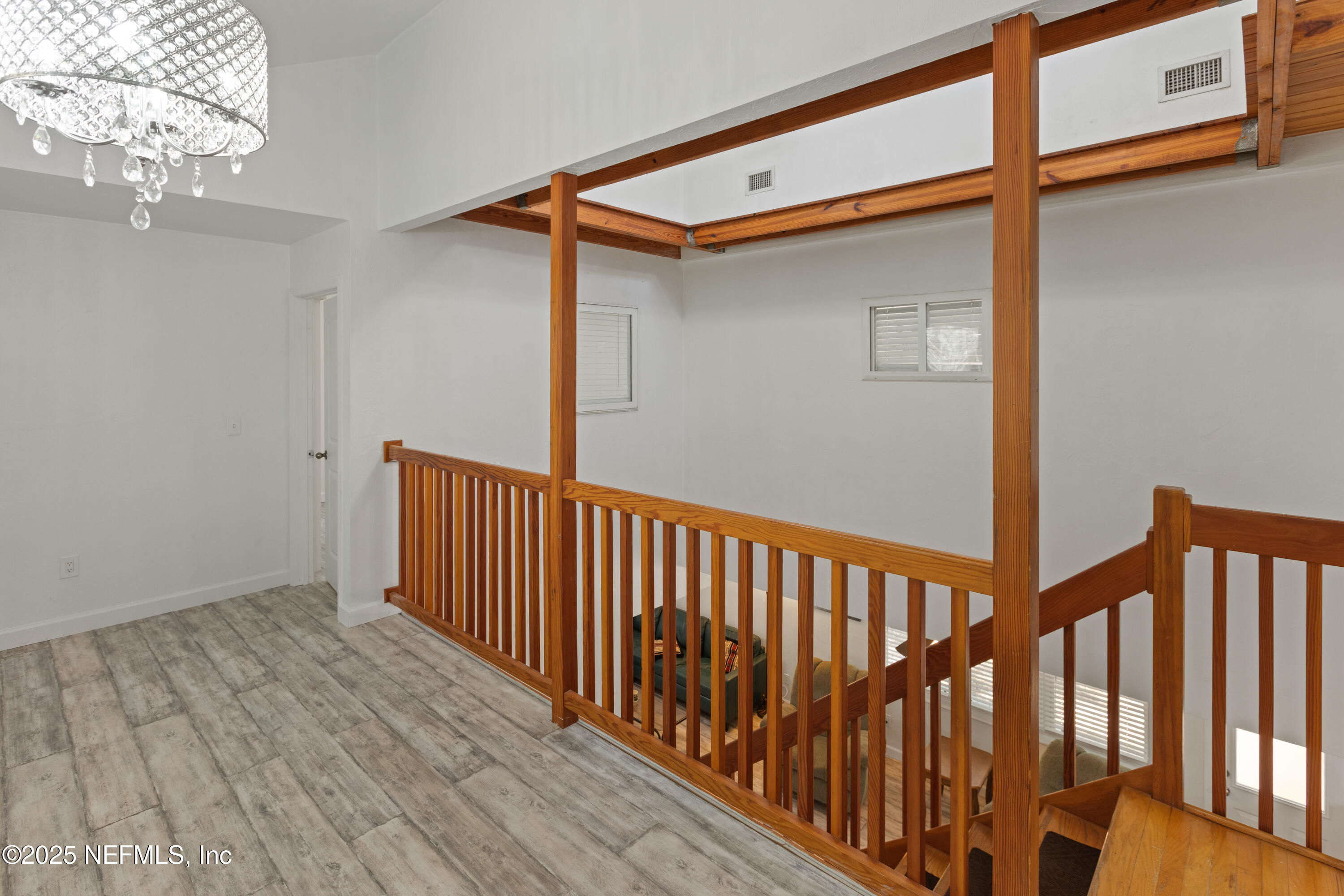 303 Southeast 3rd Avenue Melrose, FL 32666 - Photo 26 of 90 a view of a porch with wooden floor